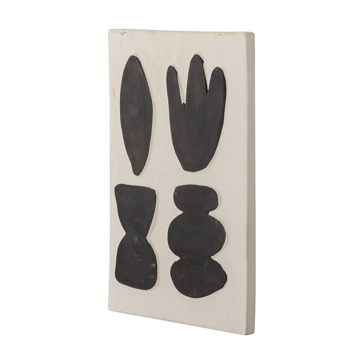 Lutton Stoneware Wall Decor in white, a rectangular ceramic panel with four black organic shapes—leaf, bud, hourglass and stacked pebbles—shown at an angle on a plain background.
