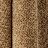Close-up of the Kahla Cotton Towel 140x70cm in Brown, showing its looped cotton pile woven in a fine two-tone zigzag with a herringbone texture.