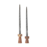 Anneli travertine candle holders, set of 2 in brown stone with tapered conical bases and round collars, shown in two heights holding tall grey taper candles on a white background.