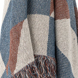 Close-up of the True Checked Cotton Throw in blue, rust, and cream, showing the woven cotton fabric's bold check pattern and knotted fringe detail.