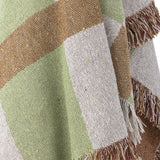 Close-up of the Galvin Checked Cotton Throw in Multi, showing a woven green, brown and cream check pattern with a nubbly texture and knotted fringe edge.