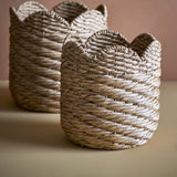 Liam Water Hyacinth Baskets Set of 2 in natural, round woven storage baskets with scalloped rims in two sizes, shown against a neutral background.