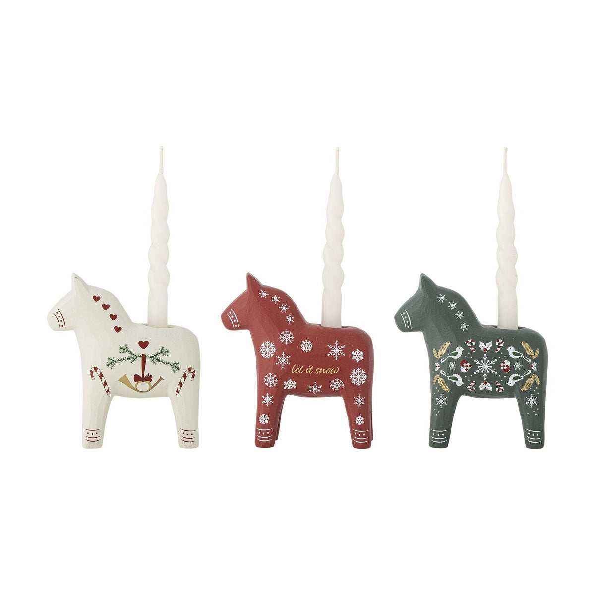 Set of 3 resin horse-shaped Christmas candle holders in white, red and green, each hand-painted with hearts, snowflakes or folk motifs, shown with taper candles on a plain background.