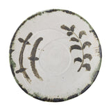 Hadyn Speckled Stoneware Tray in white, a round serving tray with low rim, dark painted branch motifs, and a dark speckled edge band, shown on a plain white background.