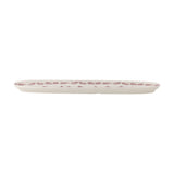 Wonderland Stoneware Christmas Platter in cream, a long narrow oval serving tray with rounded ends and a pine tree and branch pattern along the rim, shown on a plain white background.