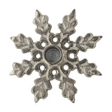 Kashi Snowflake Aluminium Christmas Candle Holder in silver, a flat star-shaped design with leaf-patterned arms and a central round cup, shown on a white background.