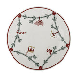 Yule Stoneware Christmas Lazy Susan in white, a round ceramic turntable with a fir garland, hearts, and hanging Christmas motifs like a pig, horn, and drum on a plain background.