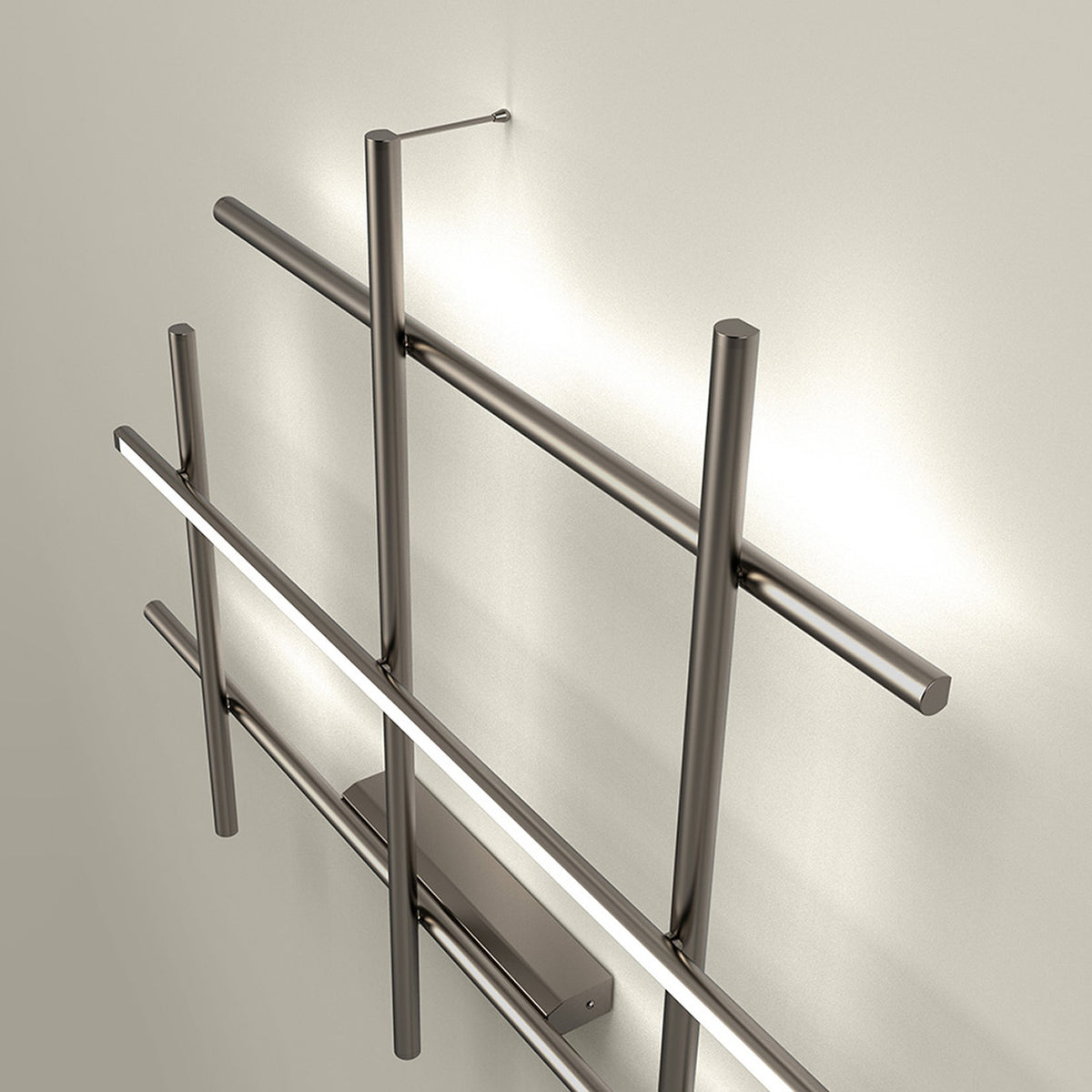 Hilow LED wall light in Brushed Titanium, an open lattice of slim crossing rods with one bar holding a black diffuser for a glowing line, shown against a neutral wall.