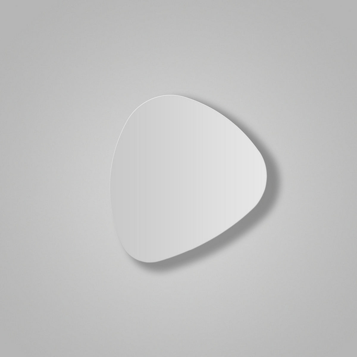 Tria 02 Wood LED wall light in a flat, pebble-like shape with a white satin finish, mounted on a plain light grey background, casting a soft shadow.