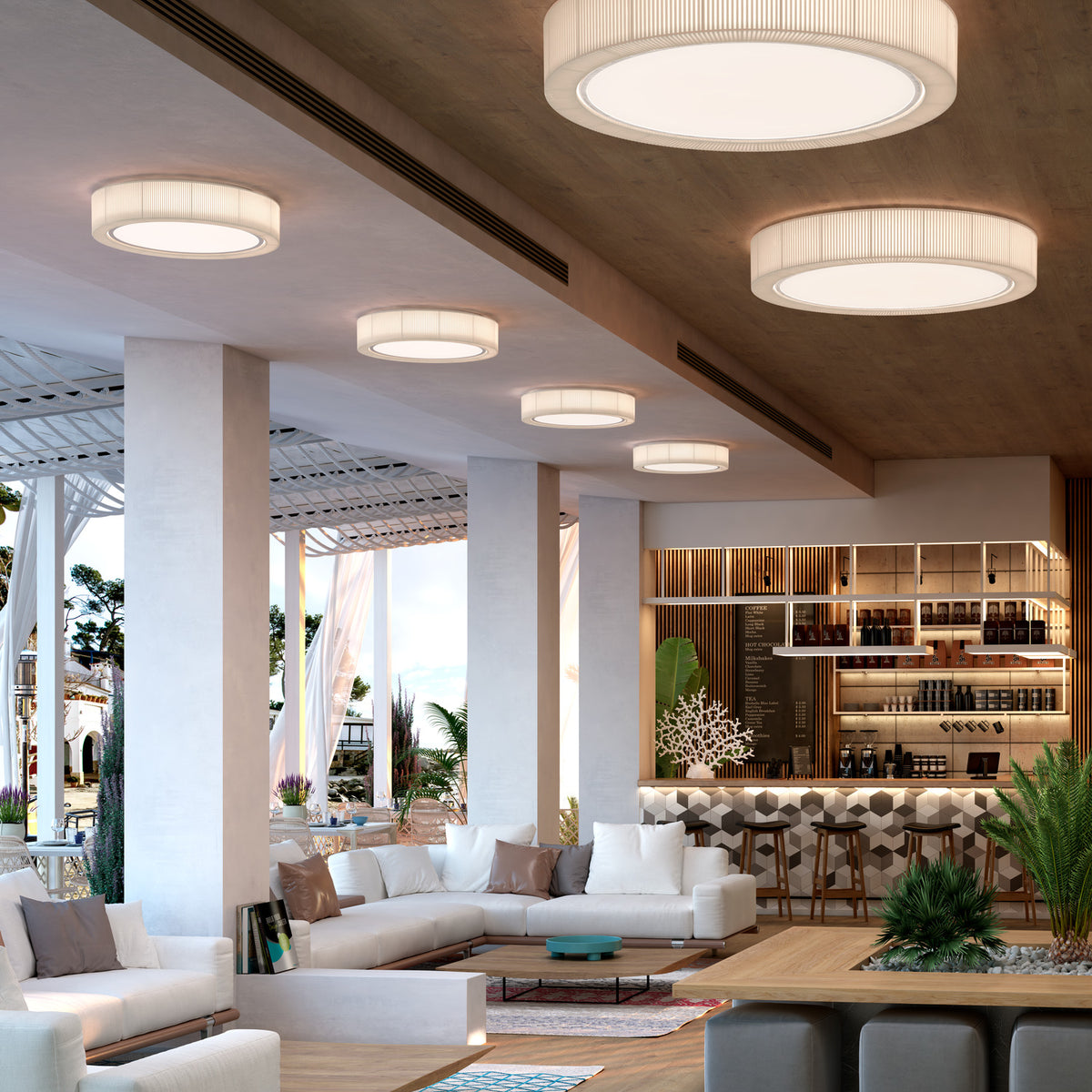 Urban PF/60 Ribbon LED ceiling lights in cream, round iron fixtures with pleated translucent shades, shown in multiples above a lounge and bar seating area.