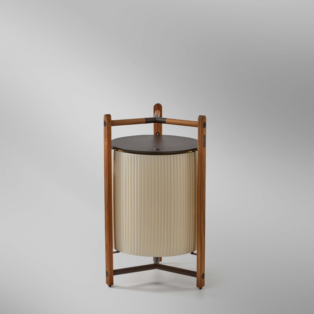 Kando P/76/R rechargeable LED floor lamp with cream pleated ribbon shade, dark round top, and tripod wooden frame, shown on a plain light background.