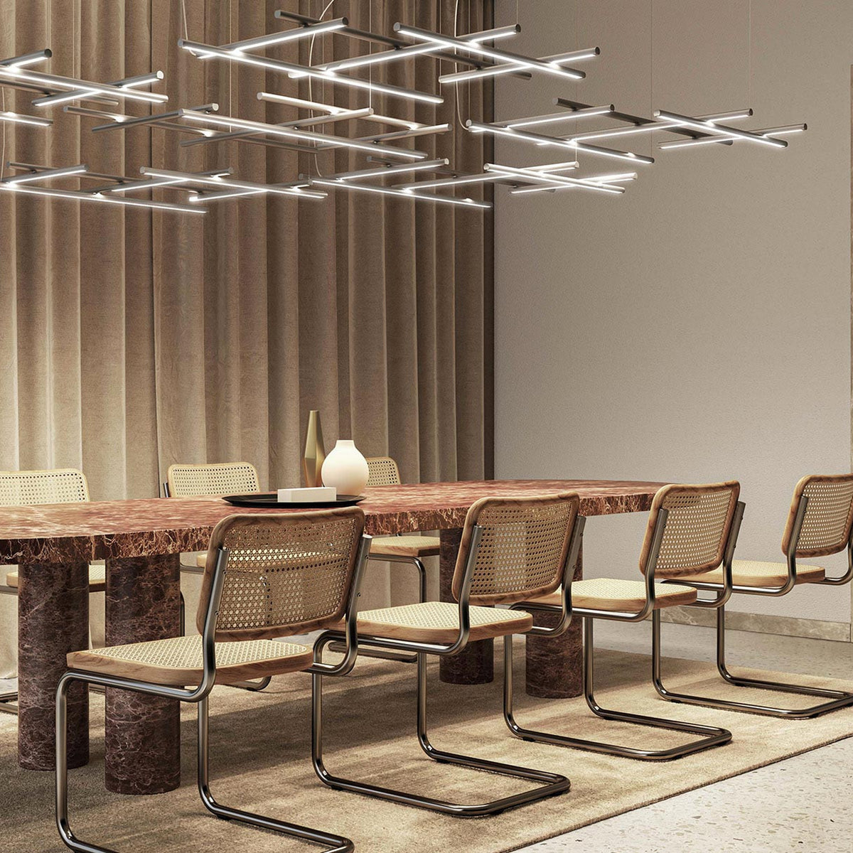 Hilow White Diffuser Frame LED pendant light with crossed linear bars in silver finish, shown above a dining table in a modern living space.