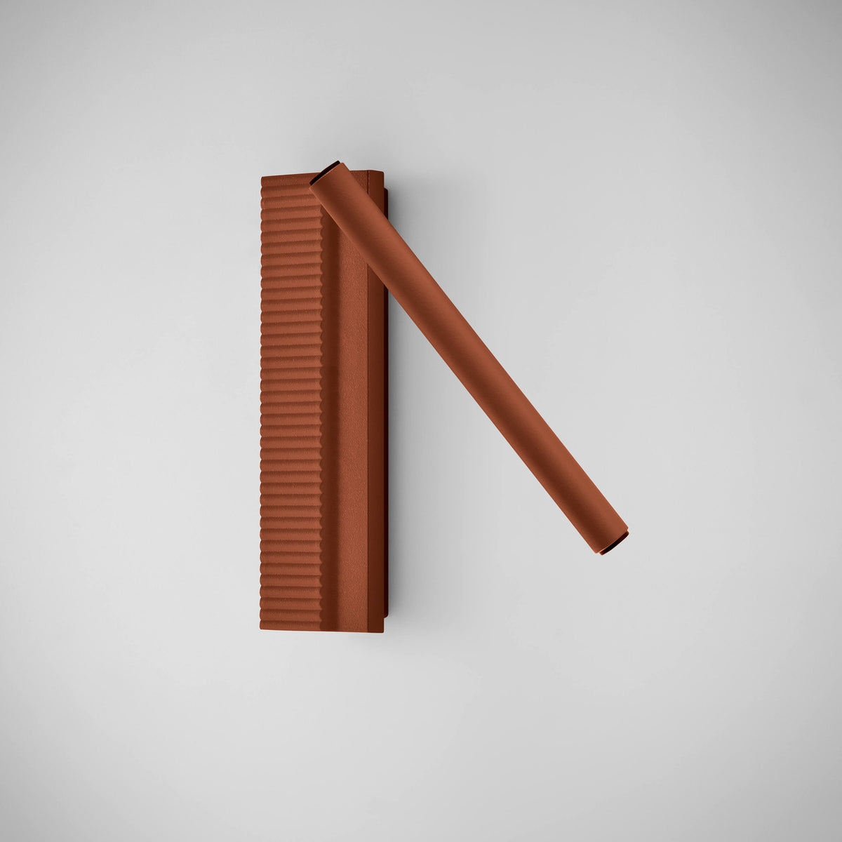 Arid A/03 LED wall light in Textured Terracotta aluminium, with a fluted upright plate and a single angled tube, shown on a plain light grey background.