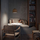 Soft S/30 Bell Outdoor Pendant Light in Olive Grey with textured diamond-pattern shade and white diffuser, shown above a dining table in a living room setting.