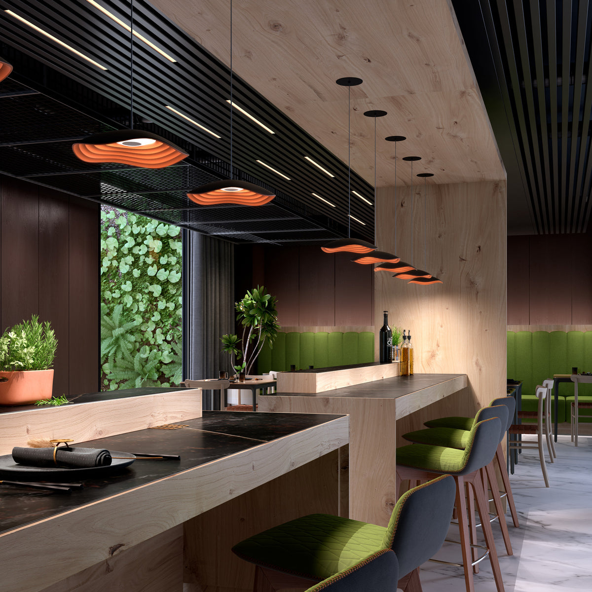 Valentina S/24 LED pendant lights with wavy black and copper tiered shades hung above a wooden bar counter in a modern dining space.