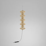 Yuyun S/9C/I fabric LED pendant light with nine stacked woven beige cotton tiers forming a tall column, hung from a slim cable against a plain light grey background.