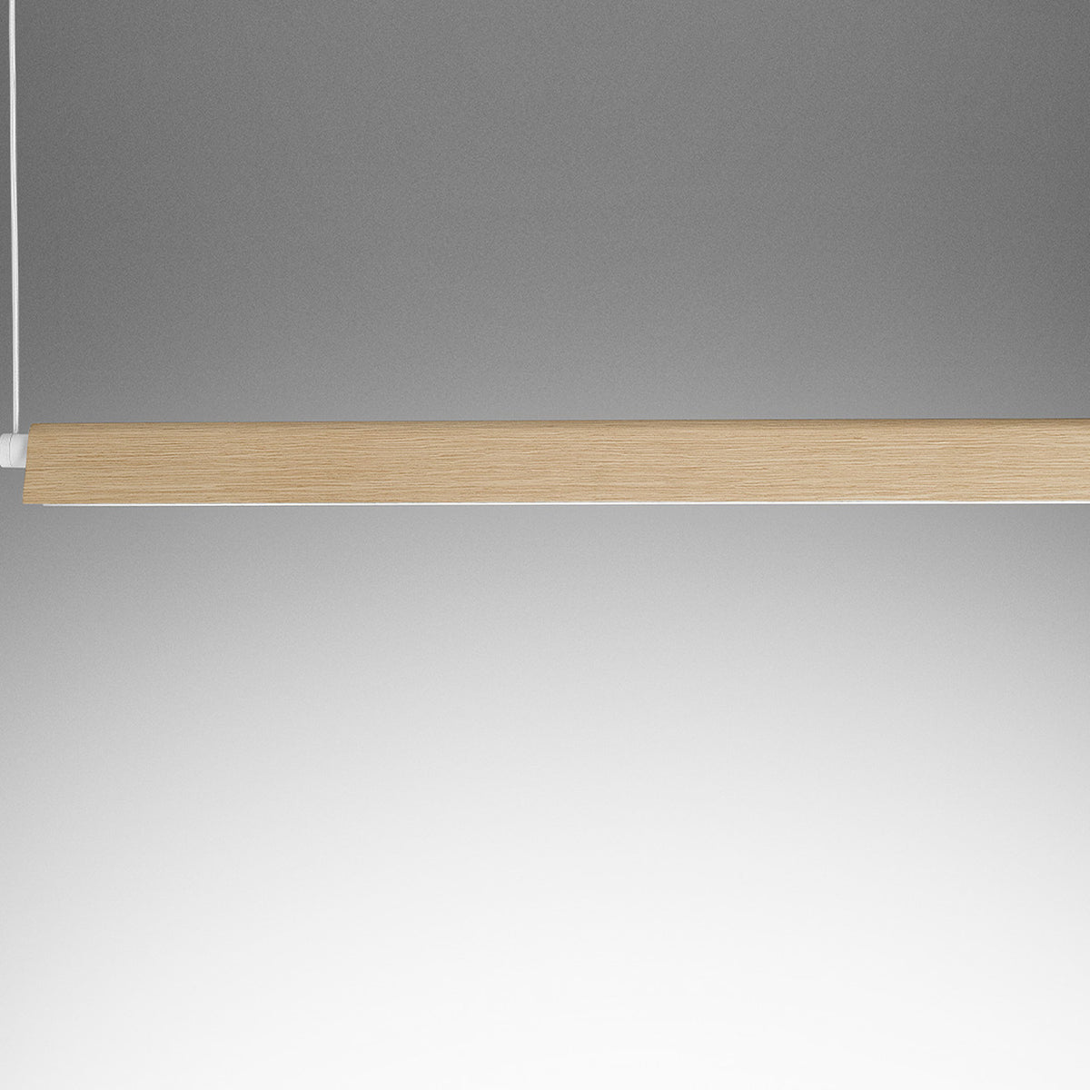 Roof S130 Casing, a slim 131cm linear pendant cover with a white folded edge and natural oak face, shown closely cropped against a plain grey background.