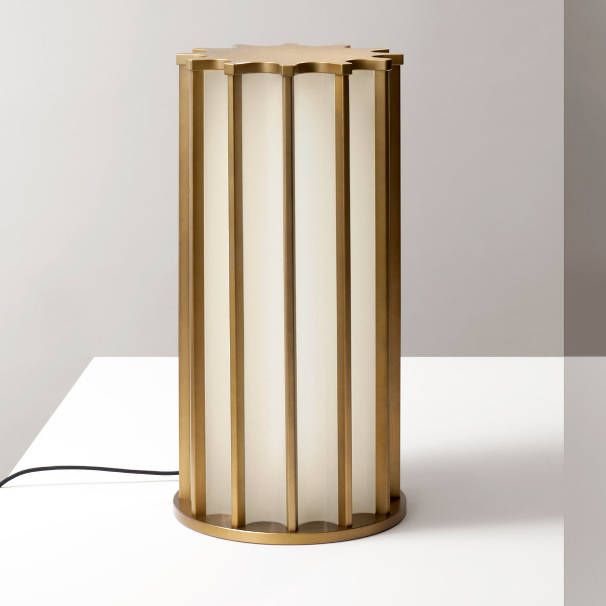 Roma Glass LED Table Lamp in Brushed Bronze, a cylindrical cage of vertical bars around white glass panels with a scalloped top and round base, shown on a plain light background.
