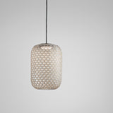 Nans S/31.2 woven LED outdoor pendant light with a tall, rounded beige lattice shade on a black cord, hung against a plain light grey background.