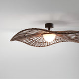Mediterrània PF/105 outdoor semi-flush ceiling light with a wide, wavy brown woven synthetic fibre disc shade and white rounded diffuser, mounted on a short stem against a plain light background.