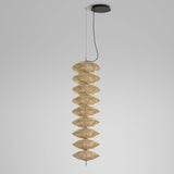 Yuyun S/9L pendant light with nine stacked woven beige cotton shades on a slim central rod, satin beige aluminium and steel frame, integrated LED, shown against a plain light grey background.