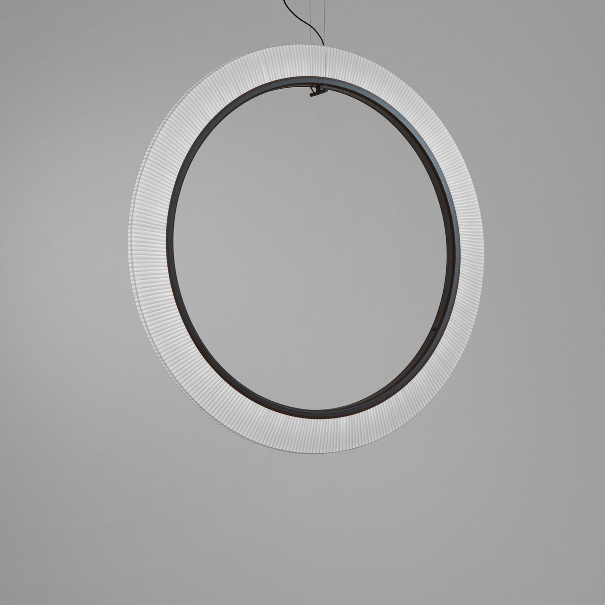 Roda S/150/V Ribbon Ring LED pendant light, a large circular fixture with white ribbon edge and dark inner ring, suspended on fine wires against a plain grey background.