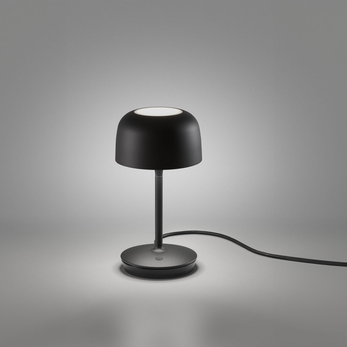 Bol M/37 Dome LED Table Lamp in matte black, featuring a rounded dome shade with round diffuser on a slim stem over a round base, shown on a plain grey background.