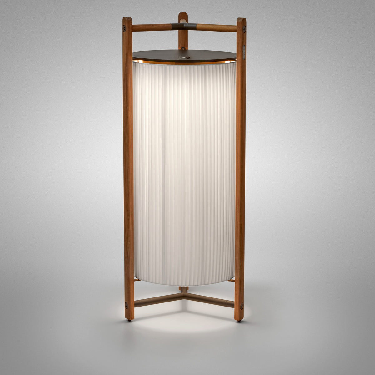 Kando P/111/R rechargeable floor lamp with pleated white ribbon cylinder shade, dark top disc, and wooden tripod frame, shown on a plain grey background.
