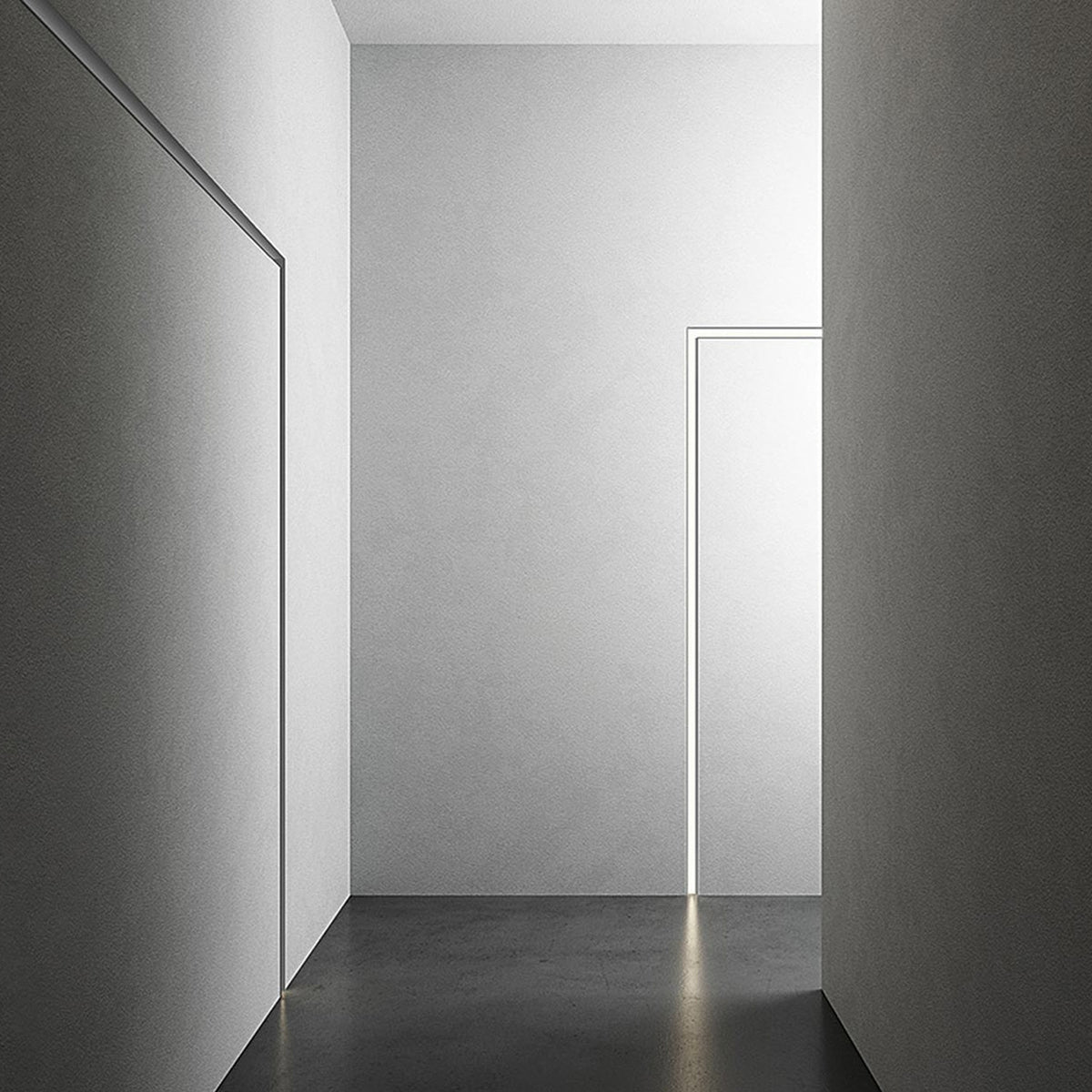 Bronx 300 recessed LED profile in black, shown as slim illuminated edge lines along wall and door frame in a minimalist grey corridor.