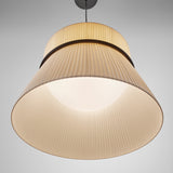 Folie S/60 Ribbon Tiered Pendant Light in cream, pleated fabric shade with straight drum top and tapered lower tier divided by a slim black ring, illuminated against a plain grey background.