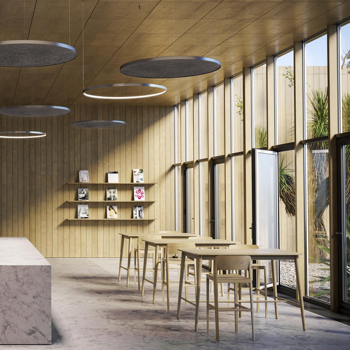 Zero Round Acoustic Panel 98cm in Brushed Titanium, flat circular ceiling panels with grey flecked underside, shown suspended above a wood-panelled café seating area.