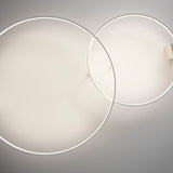 Zero Round Aluminium Ring LED Wall & Ceiling Light, 98cm, shown as two overlapping slim circular rings in white finish mounted on a wall bracket against a grey background.