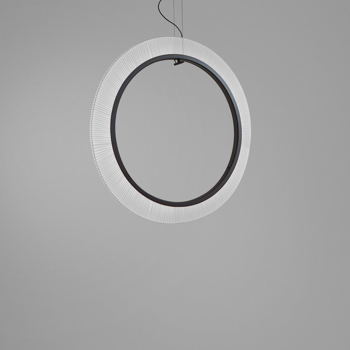 Roda S/120/V Ribbon Ring LED pendant light, a large vertical ring with pleated cream translucent shade around a dark inner ring, suspended on fine wires against a plain grey background.