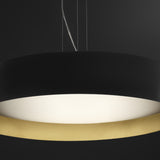 Ginevra 50 drum LED pendant light in matt black with a brass inner band, wide flat drum shape and glowing white diffuser underside, shown against a dark background.
