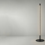Solid F 240 Cylinder LED Floor Lamp with a slim black stem on a round disc base, featuring a long illuminated vertical strip against a plain grey background.