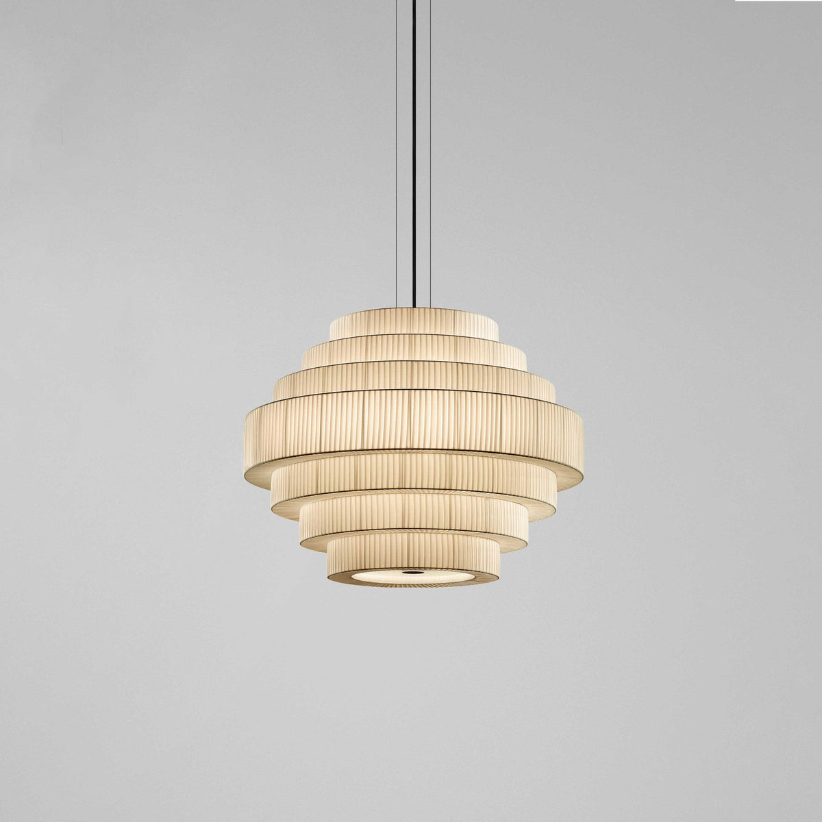 Mos 02 Ribbon Tiered Pendant Light with seven pleated beige translucent ribbon tiers in a beehive shape, iron structure, shown on a plain grey background.