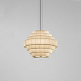 Mos 02 Ribbon Tiered Pendant Light with seven pleated beige translucent ribbon tiers in a beehive shape, iron structure, shown on a plain grey background.