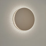 Helios A/02 round wall light in Oak Brown & Beige, flat disc face with a cotton thread edge casting a radiating LED glow on a plain light background.
