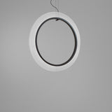 Roda S/120/V Ribbon Ring LED pendant light, a large circular fixture with pleated white translucent ribbon around a black inner ring, suspended on thin cables against a plain grey background.