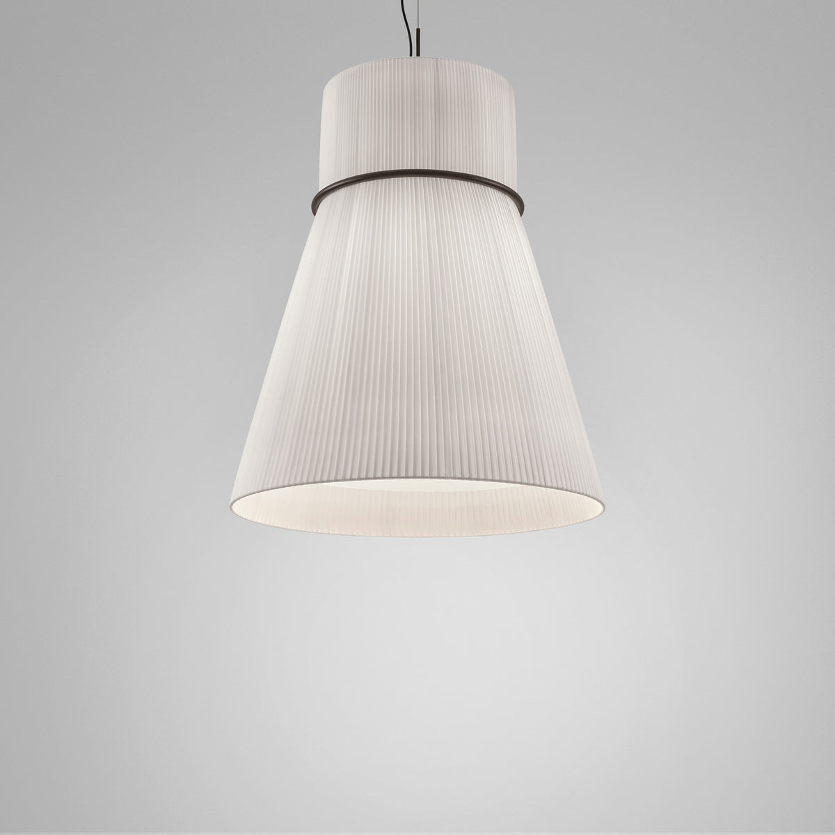 Folie S/70 Ribbon Cone pendant light with white pleated translucent shade shaped as a cylinder over a wide cone, joined by a slim black ring, on a plain light grey background.