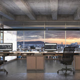 Giano Aluminium Linear LED Pendant Light 151.8cm in black, suspended above two desks in a modern office workspace with a city skyline view.