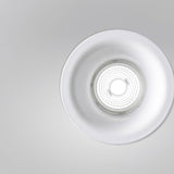 Joe Aluminium Round Recessed LED Downlight 9cm in white, close-up of deep flared trim and ribbed lens with warm white light, shown on a plain grey background.