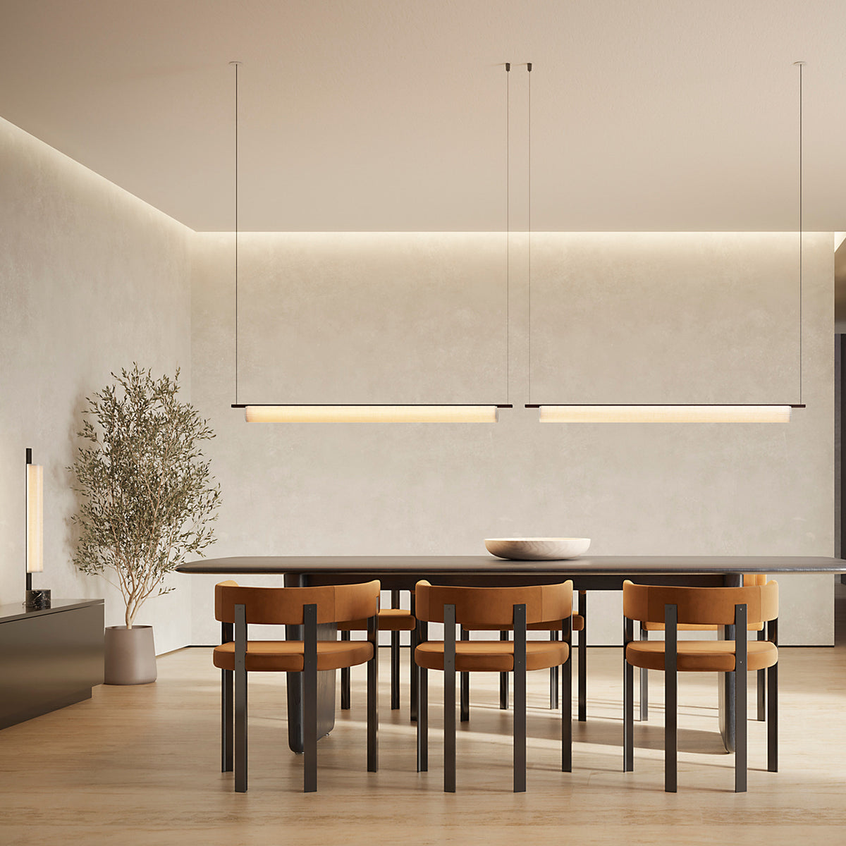 Two Ombra Fabric LED Pendant Lights, 165.2cm slim cylindrical diffusers in off-white, suspended on fine wires above a wooden dining table with tan chairs.