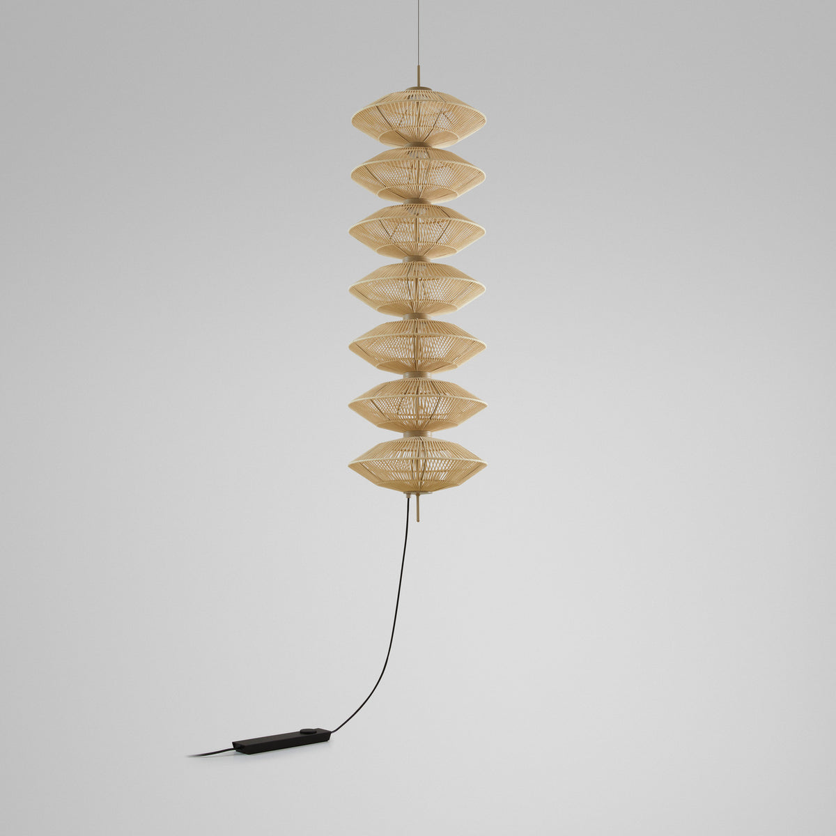 Yuyun S/7L/I pendant light with seven stacked woven beige cotton thread shades on an aluminium and steel frame, shown with cable and inline switch on a plain light background.