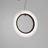 Roda S/90/V Ribbon Ring LED pendant light, a large circular fixture with finely pleated white translucent shade around a dark inner ring, suspended on thin cables against a plain grey background.