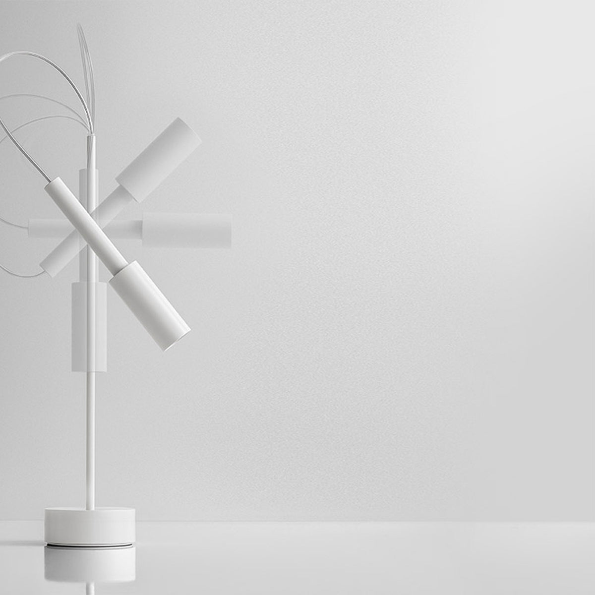 Tubino Aluminium LED Table Lamp in white, with angled cylindrical head, slim upright stem, arched cable detail and round base, shown on a plain white background.
