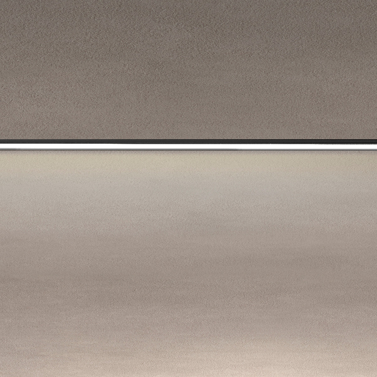 Close-up of the Street Line Linear LED Track Spotlight in black, showing the slim bar's continuous white diffuser strip set between grey ceiling and wall surfaces.