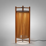 Kando P/111 outdoor floor lamp, lantern-style with teak wood frame and sand nautical cord cylinder, dark brown top disc, integrated LED glow, on a plain light background.
