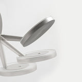 Bella Direct Aluminium LED Wall & Ceiling Light close-up, showing round brushed silver base, slim angled arm and tilted flat disc head, on a plain white background.