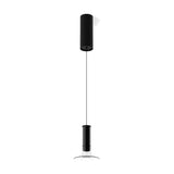 Matt black Auriel Glass Candle LED Pendant Light with a slim cylinder in a clear glass tube and flat disc, hung from a black cable and ceiling canopy on a white background.